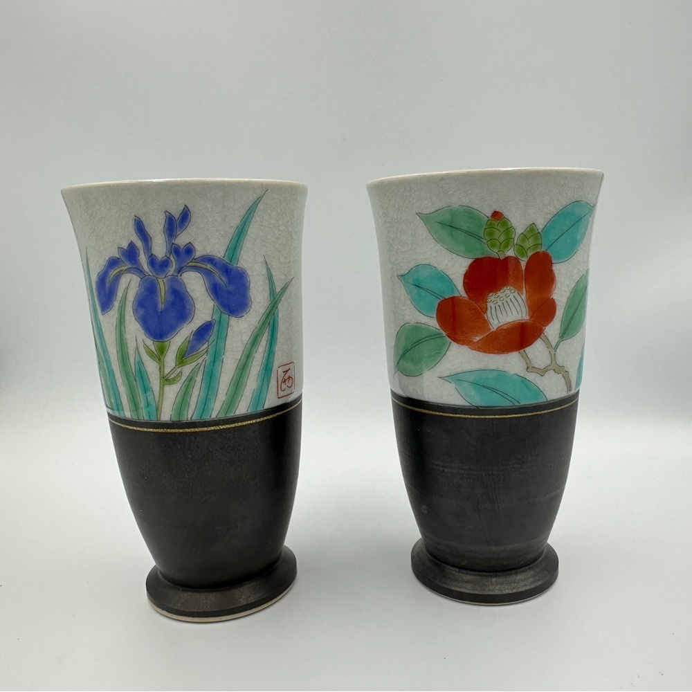 Pair of Japanese sake cups with flower design. Signed on bottom